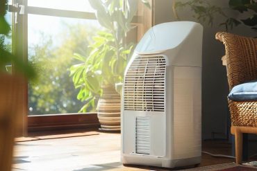 good looking dehumidifier placed in a cosy living room with a nice sunny view from terase